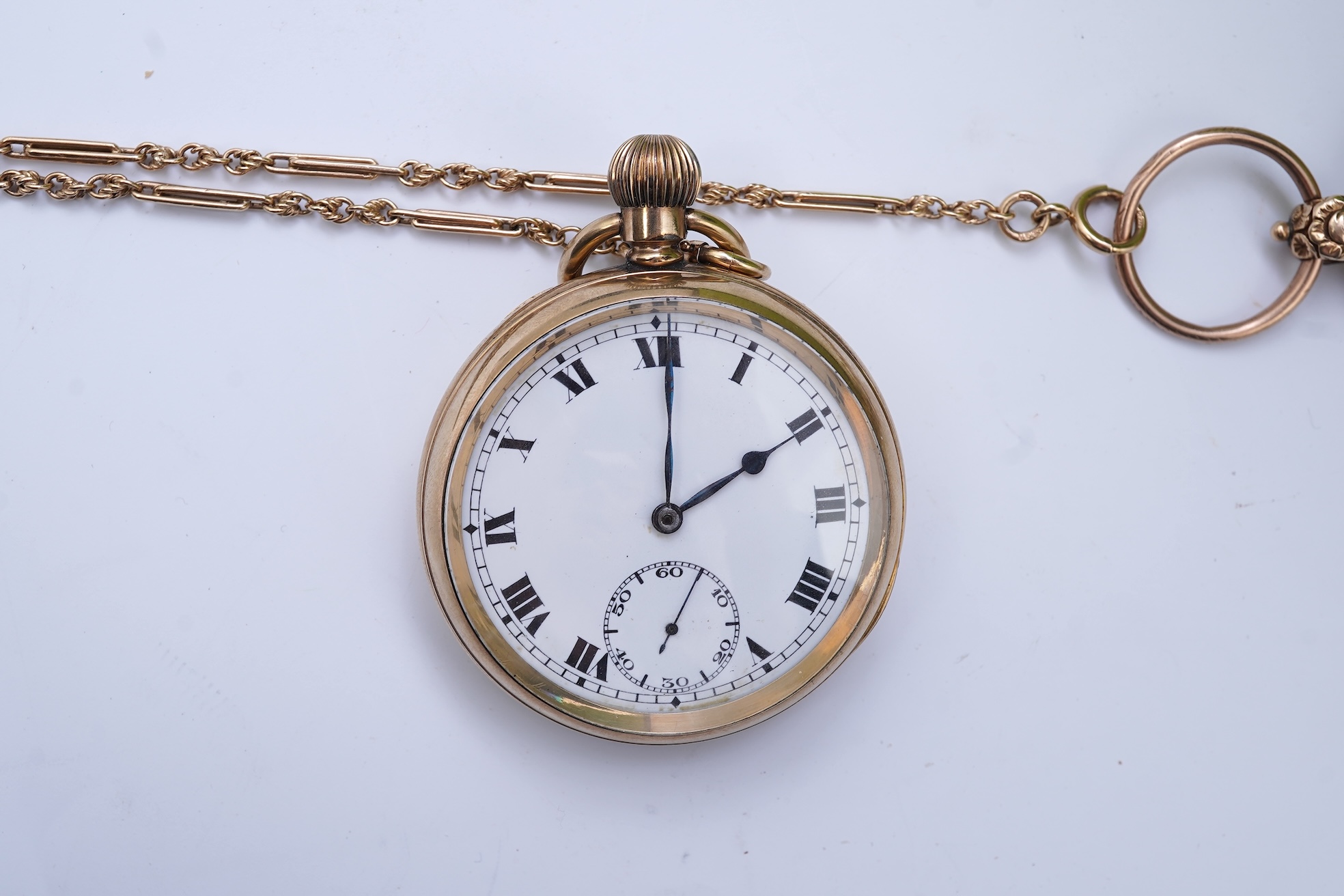 An amethyst fob seal, a gold Albert chain, and a pocket watch